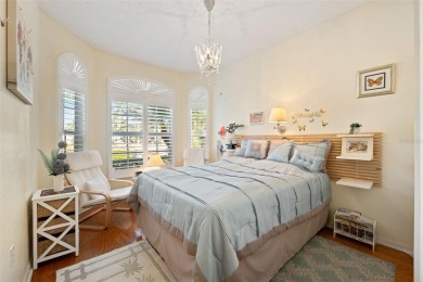 Welcome to this charming 3-bedroom, 2-bathroom WATERFRONT home on East Lake Woodlands Country Club in Florida - for sale on GolfHomes.com, golf home, golf lot