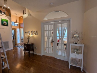Welcome to this charming 3-bedroom, 2-bathroom WATERFRONT home on East Lake Woodlands Country Club in Florida - for sale on GolfHomes.com, golf home, golf lot