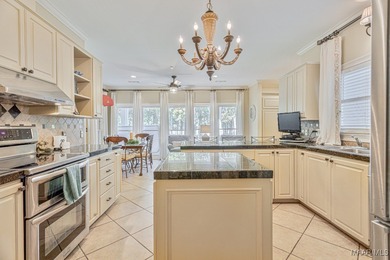 Nestled among mature trees and overlooking Wynlakes Golf Course on Wynlakes Golf and Country Club in Alabama - for sale on GolfHomes.com, golf home, golf lot