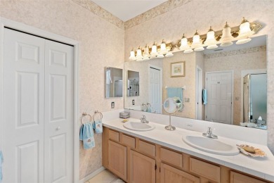 Welcome to this charming 3-bedroom, 2-bathroom WATERFRONT home on East Lake Woodlands Country Club in Florida - for sale on GolfHomes.com, golf home, golf lot