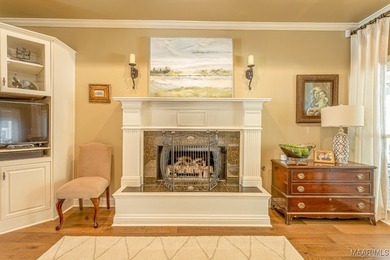 Nestled among mature trees and overlooking Wynlakes Golf Course on Wynlakes Golf and Country Club in Alabama - for sale on GolfHomes.com, golf home, golf lot