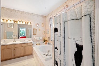 Welcome to this charming 3-bedroom, 2-bathroom WATERFRONT home on East Lake Woodlands Country Club in Florida - for sale on GolfHomes.com, golf home, golf lot