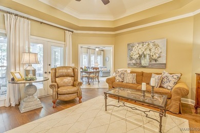 Nestled among mature trees and overlooking Wynlakes Golf Course on Wynlakes Golf and Country Club in Alabama - for sale on GolfHomes.com, golf home, golf lot