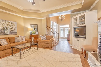 Nestled among mature trees and overlooking Wynlakes Golf Course on Wynlakes Golf and Country Club in Alabama - for sale on GolfHomes.com, golf home, golf lot