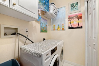 Welcome to this charming 3-bedroom, 2-bathroom WATERFRONT home on East Lake Woodlands Country Club in Florida - for sale on GolfHomes.com, golf home, golf lot