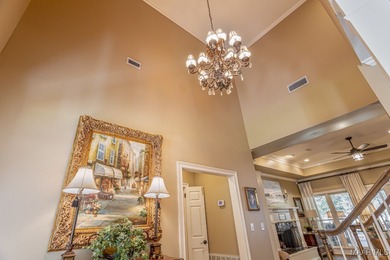 Nestled among mature trees and overlooking Wynlakes Golf Course on Wynlakes Golf and Country Club in Alabama - for sale on GolfHomes.com, golf home, golf lot