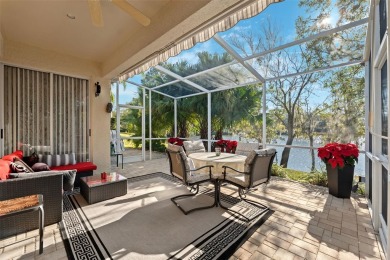 Welcome to this charming 3-bedroom, 2-bathroom WATERFRONT home on East Lake Woodlands Country Club in Florida - for sale on GolfHomes.com, golf home, golf lot