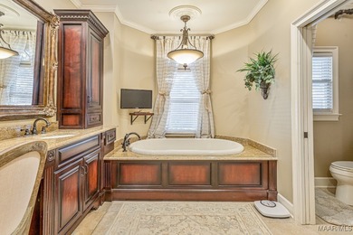 Nestled among mature trees and overlooking Wynlakes Golf Course on Wynlakes Golf and Country Club in Alabama - for sale on GolfHomes.com, golf home, golf lot