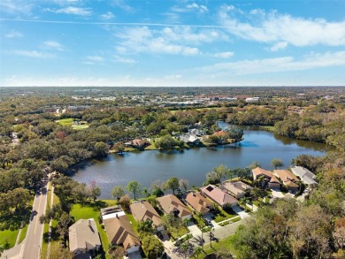 Welcome to this charming 3-bedroom, 2-bathroom WATERFRONT home on East Lake Woodlands Country Club in Florida - for sale on GolfHomes.com, golf home, golf lot