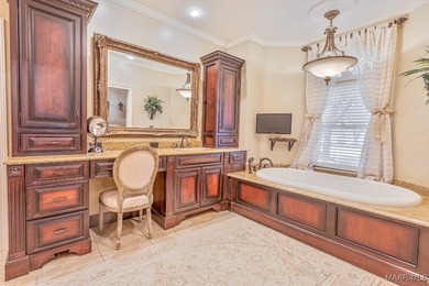 Nestled among mature trees and overlooking Wynlakes Golf Course on Wynlakes Golf and Country Club in Alabama - for sale on GolfHomes.com, golf home, golf lot