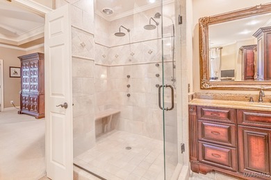 Nestled among mature trees and overlooking Wynlakes Golf Course on Wynlakes Golf and Country Club in Alabama - for sale on GolfHomes.com, golf home, golf lot