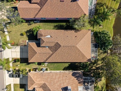 Welcome to this charming 3-bedroom, 2-bathroom WATERFRONT home on East Lake Woodlands Country Club in Florida - for sale on GolfHomes.com, golf home, golf lot