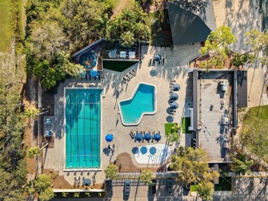 Welcome to this charming 3-bedroom, 2-bathroom WATERFRONT home on East Lake Woodlands Country Club in Florida - for sale on GolfHomes.com, golf home, golf lot