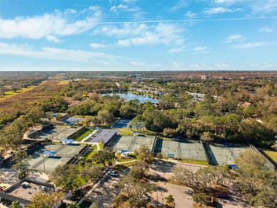 Welcome to this charming 3-bedroom, 2-bathroom WATERFRONT home on East Lake Woodlands Country Club in Florida - for sale on GolfHomes.com, golf home, golf lot