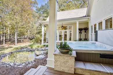 Nestled among mature trees and overlooking Wynlakes Golf Course on Wynlakes Golf and Country Club in Alabama - for sale on GolfHomes.com, golf home, golf lot