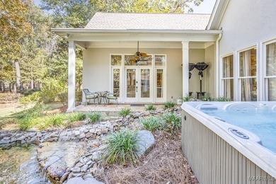 Nestled among mature trees and overlooking Wynlakes Golf Course on Wynlakes Golf and Country Club in Alabama - for sale on GolfHomes.com, golf home, golf lot