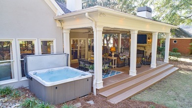 Nestled among mature trees and overlooking Wynlakes Golf Course on Wynlakes Golf and Country Club in Alabama - for sale on GolfHomes.com, golf home, golf lot