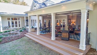 Nestled among mature trees and overlooking Wynlakes Golf Course on Wynlakes Golf and Country Club in Alabama - for sale on GolfHomes.com, golf home, golf lot