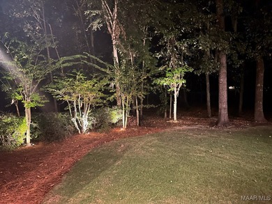 Nestled among mature trees and overlooking Wynlakes Golf Course on Wynlakes Golf and Country Club in Alabama - for sale on GolfHomes.com, golf home, golf lot