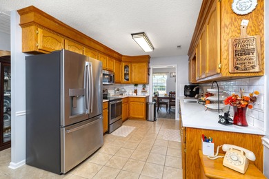 This beautiful home features luxury vinyl plank and ceramic on Beech Creek Golf Club in South Carolina - for sale on GolfHomes.com, golf home, golf lot