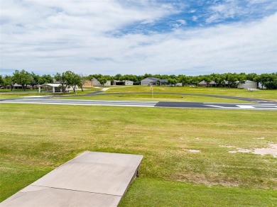RUNWAY LIVING AT ITS FINEST!  Live where you fly in this on Pecan Plantation Country Club in Texas - for sale on GolfHomes.com, golf home, golf lot