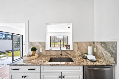 Fully updated 2-bedroom, 2-bath residence on Club House Drive on Palm Harbor Golf Club in Florida - for sale on GolfHomes.com, golf home, golf lot