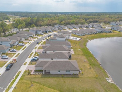 Stunning 4 bedroom, 2 bath lakefront home is nestled in the on LPGA International Golf Course in Florida - for sale on GolfHomes.com, golf home, golf lot
