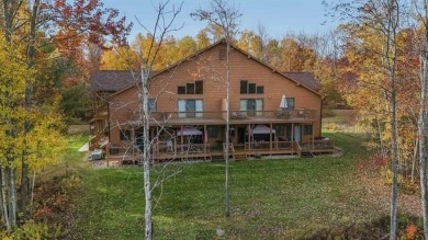 Vista Del Verde #4 is a peaceful corner condo that overlooks the on Schuss Mountain Golf Club in Michigan - for sale on GolfHomes.com, golf home, golf lot