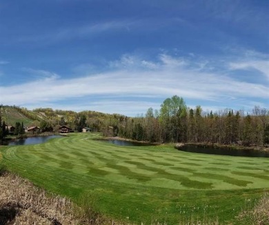 Vista Del Verde #4 is a peaceful corner condo that overlooks the on Schuss Mountain Golf Club in Michigan - for sale on GolfHomes.com, golf home, golf lot