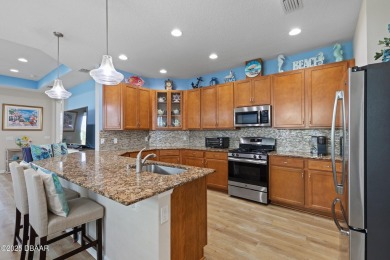 Escape to Paradise in this Barbuda Villa on a POND! This beauty on LPGA International Golf Course in Florida - for sale on GolfHomes.com, golf home, golf lot