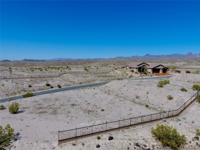 This private corner homesite offers  views of the  golf course on Laughlin Ranch Golf Club in Arizona - for sale on GolfHomes.com, golf home, golf lot