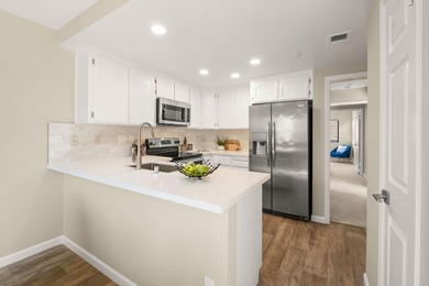 Located behind the gates of Rossmoor, this light-filled home on Rossmoor Golf Course in California - for sale on GolfHomes.com, golf home, golf lot