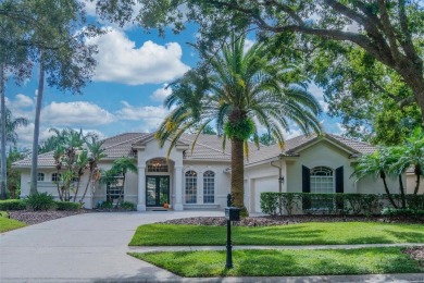 Exceptional home located on the 14th green of the Fazio designed on Hunters Green Country Club in Florida - for sale on GolfHomes.com, golf home, golf lot