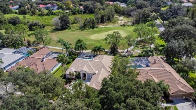 Exceptional home located on the 14th green of the Fazio designed on Hunters Green Country Club in Florida - for sale on GolfHomes.com, golf home, golf lot