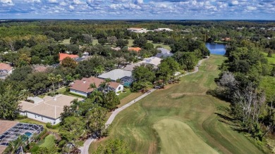 Exceptional home located on the 14th green of the Fazio designed on Hunters Green Country Club in Florida - for sale on GolfHomes.com, golf home, golf lot