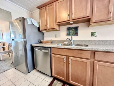Welcome to this beautifully maintained 2-bedroom, 2-bath condo on Cove Cay Country Club in Florida - for sale on GolfHomes.com, golf home, golf lot