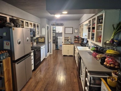 Stunning 4-bedroom home with a bonus room to make it 5 bedrooms! on Bella Vista Country Club and Golf Course in Arkansas - for sale on GolfHomes.com, golf home, golf lot
