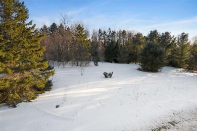 Experience the essence of Northern Michigan living with this on Boyne Highlands Golf Courses in Michigan - for sale on GolfHomes.com, golf home, golf lot