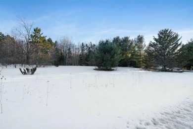 Experience the essence of Northern Michigan living with this on Boyne Highlands Golf Courses in Michigan - for sale on GolfHomes.com, golf home, golf lot