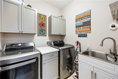 Luxurious townhome with stunning lagoon views overlooking the on Hampton Pointe Golf Course in South Carolina - for sale on GolfHomes.com, golf home, golf lot