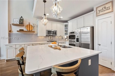 Luxurious townhome with stunning lagoon views overlooking the on Hampton Pointe Golf Course in South Carolina - for sale on GolfHomes.com, golf home, golf lot