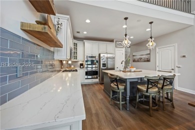 Luxurious townhome with stunning lagoon views overlooking the on Hampton Pointe Golf Course in South Carolina - for sale on GolfHomes.com, golf home, golf lot