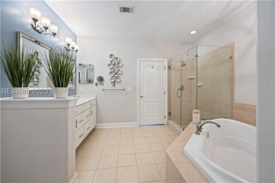 Luxurious townhome with stunning lagoon views overlooking the on Hampton Pointe Golf Course in South Carolina - for sale on GolfHomes.com, golf home, golf lot