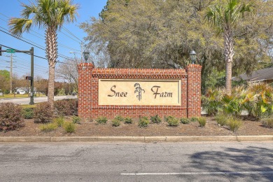 Tucked within the serene enclave of Snee Farm Gardens on the on Snee Farm Country Club in South Carolina - for sale on GolfHomes.com, golf home, golf lot