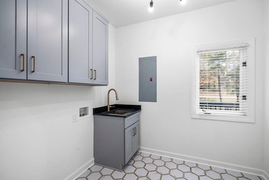 Welcome to this completely updated 4-bedroom, 3-bathroom home in on Woodside Plantation Country Club in South Carolina - for sale on GolfHomes.com, golf home, golf lot