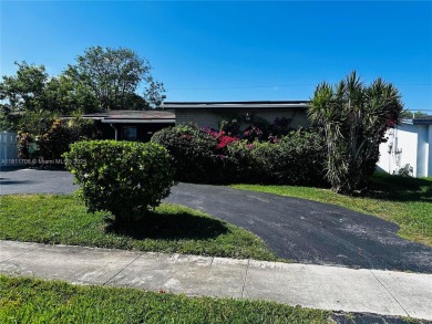 Modern Luxe Sanctuary in Sunrise. Step into your private oasis on Sunrise Lakes Phase III in Florida - for sale on GolfHomes.com, golf home, golf lot