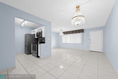 Paradise awaits! Bright and beautiful first floor unit with on Flamingo Lakes Country Club in Florida - for sale on GolfHomes.com, golf home, golf lot