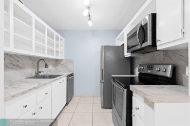 Paradise awaits! Bright and beautiful first floor unit with on Flamingo Lakes Country Club in Florida - for sale on GolfHomes.com, golf home, golf lot