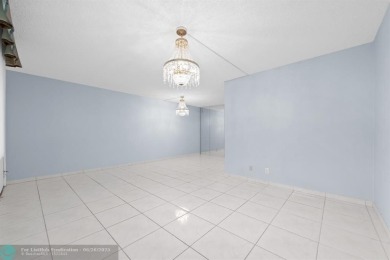 Paradise awaits! Bright and beautiful first floor unit with on Flamingo Lakes Country Club in Florida - for sale on GolfHomes.com, golf home, golf lot