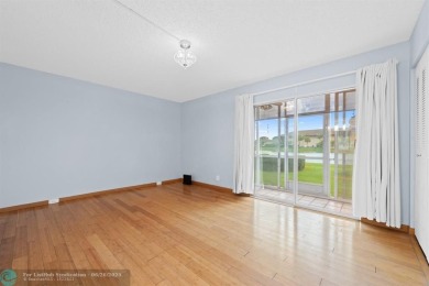 Paradise awaits! Bright and beautiful first floor unit with on Flamingo Lakes Country Club in Florida - for sale on GolfHomes.com, golf home, golf lot